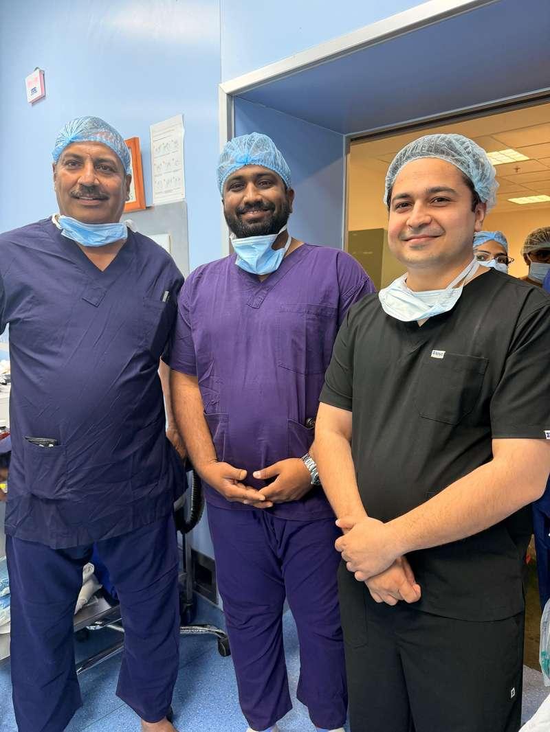 Surgical team and faculty in scrub attire at PGI Chandigarh